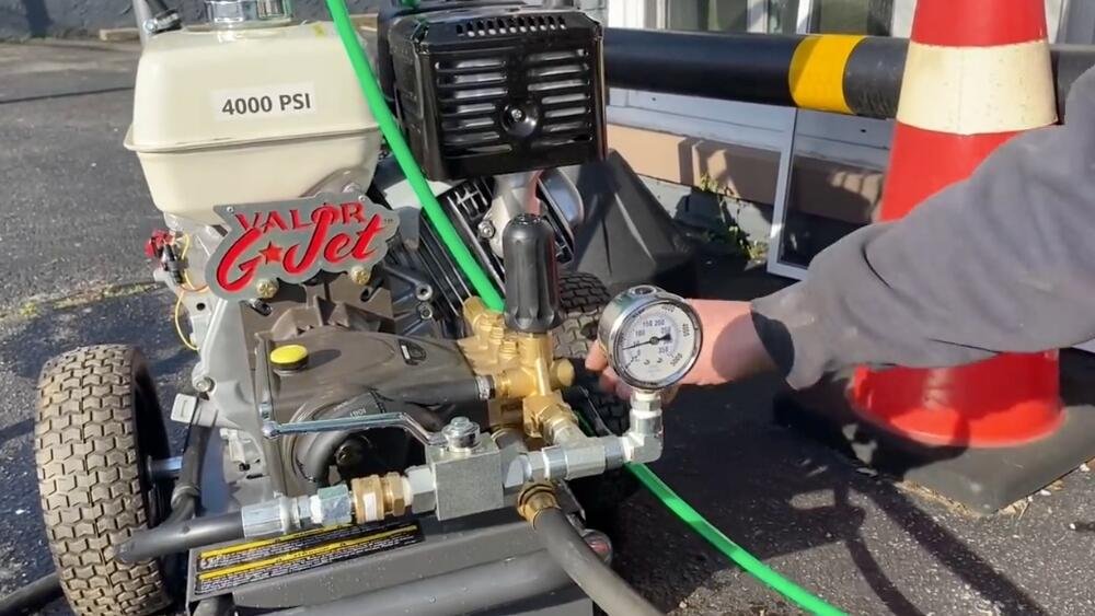 Professional hydro jetting machine with 4000 PSI pressure gauge used for sewer line cleaning in Los Angeles.