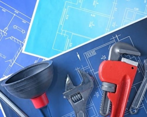 Professional plumbing service tools, including a wrench, plunger, and pipe wrench on a blueprint background.